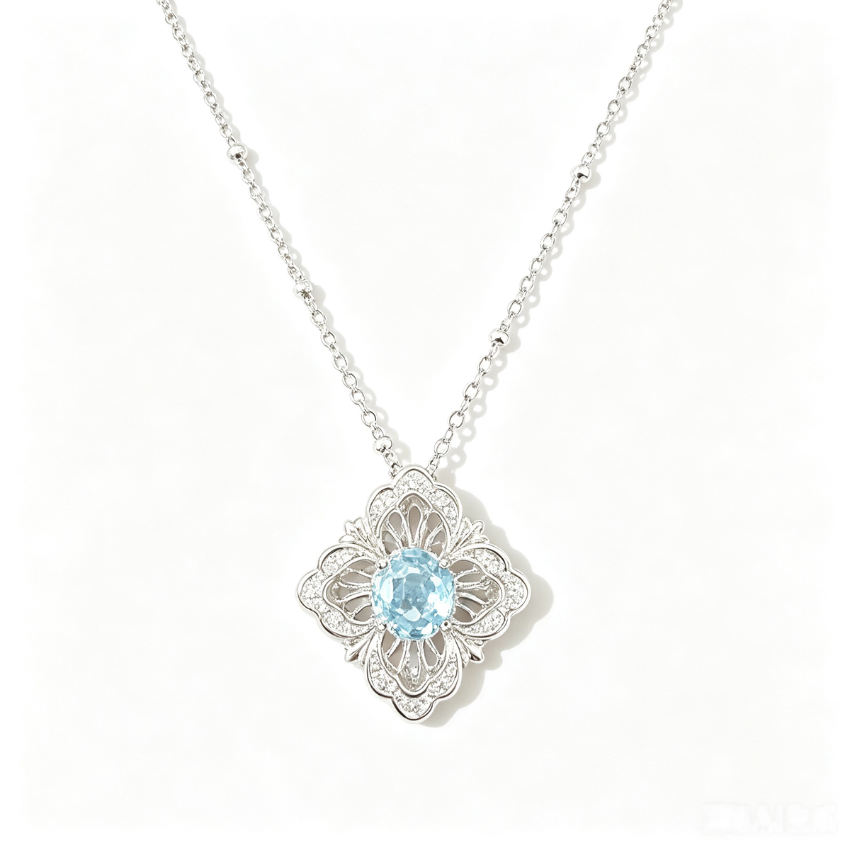 Ice‑Blue Four‑Leaf Kaleidoscope Necklace